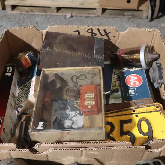 Box Automobilia, License Plates, Spark Plugs, Books Ect