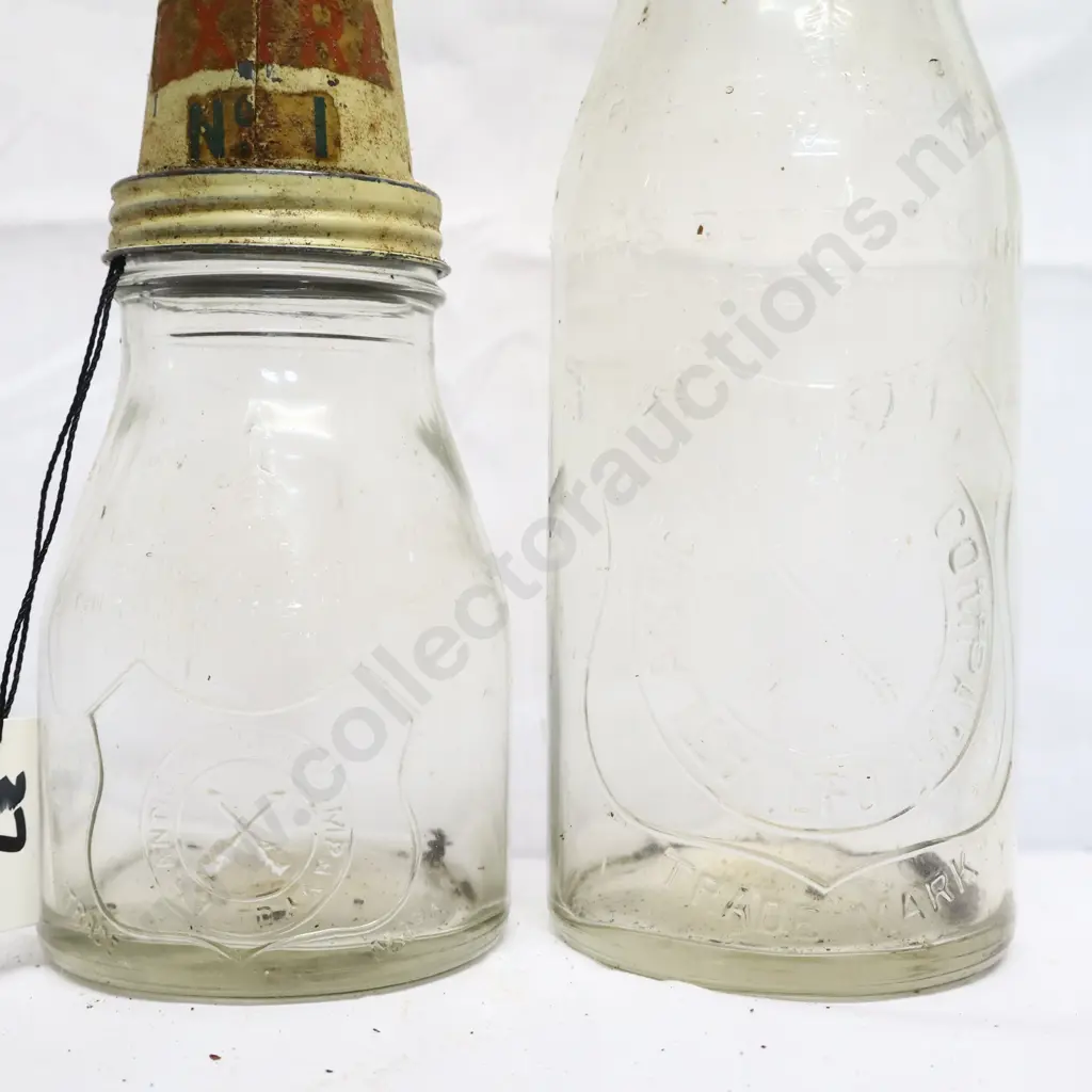 Pair of Antantic Oil Embossed Oil Bottles And Tin Tops Image 1++