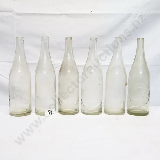 Collection of Vintage 26oz Embossed Crown Top Bottles #1