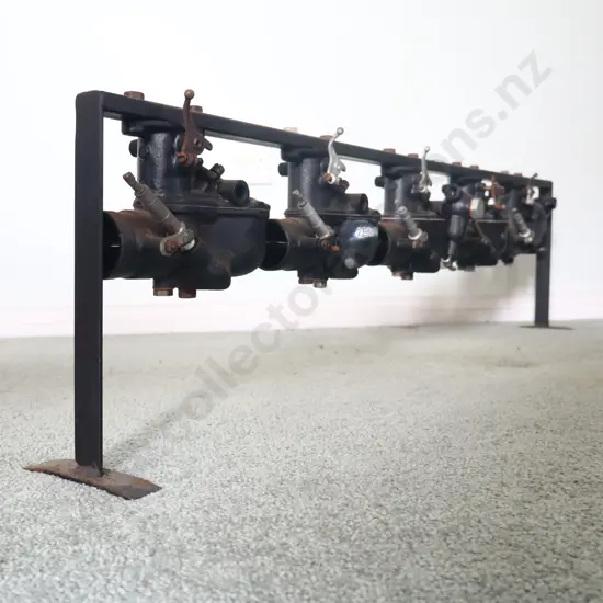 Ford Model A Carburators X 5 On Display Stand.
